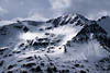 Schneeglitzer auf Bergflanken Photo Lichteinfall Zoom von Hochalpenstrae durch Gipfelfelsen