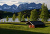 Black-lake nature photos Alps Wild-Kaiser mountains skyline over wood barn green meadow