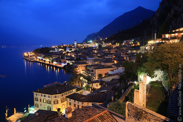 Limone cityscape nightly lights on Lake Garda romantic blue water mount skyline twilight mood
