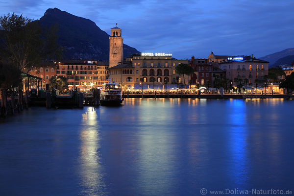 Riva Garda Lake city photo blue waterscape nightly lights romantic mood harbor tower mount skyline twilight
