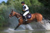 Cross country photo like painting horse-ride in water-squirts blur fuzziness dynamic moved scene